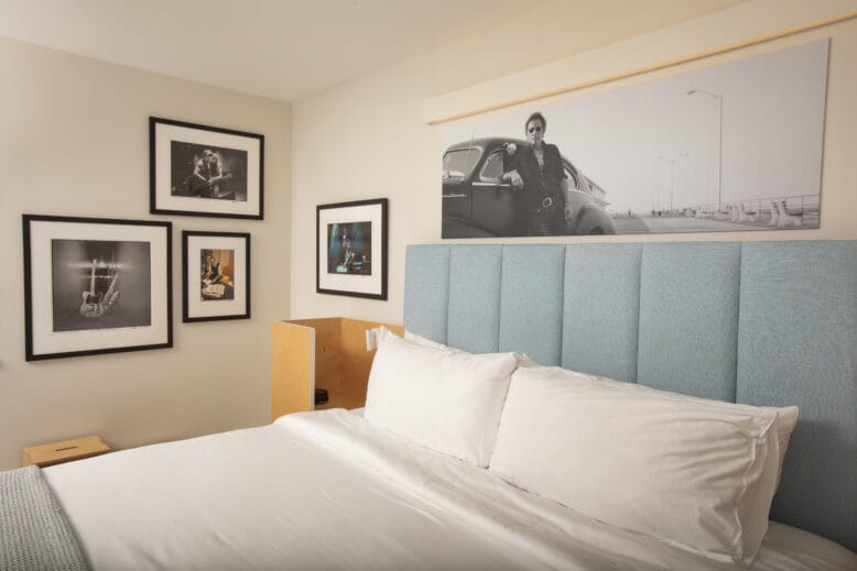 Bedding and framed photos of Bruce Springsteen at the Boss Suite at the Asbury Hotel in Asbury Park, New Jersey