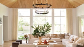 In Westfield, NJ, a large open family room with an expansive chandelier above.
