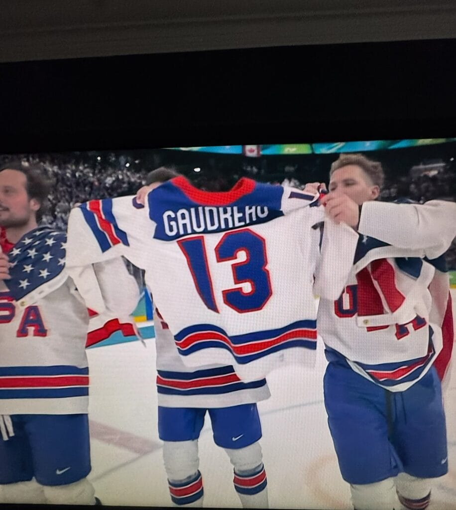 <b>A jersey honoring late NHL star Johnny Gaudreau makes its ways around the ice after Team USA's win.