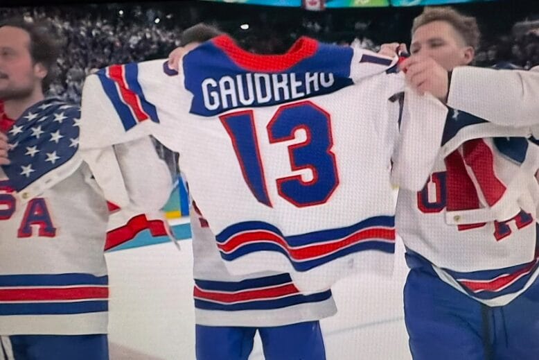 A jersey honoring late NHL star Johnny Gaudreau makes its ways around the ice after Team USA's win. Photo: NBC screenshot