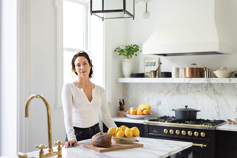 Woman in kitchen of Jersey City brownstone