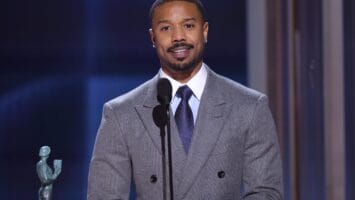 Michael B. Jordan accepts an award at the SAG Actor Awards.