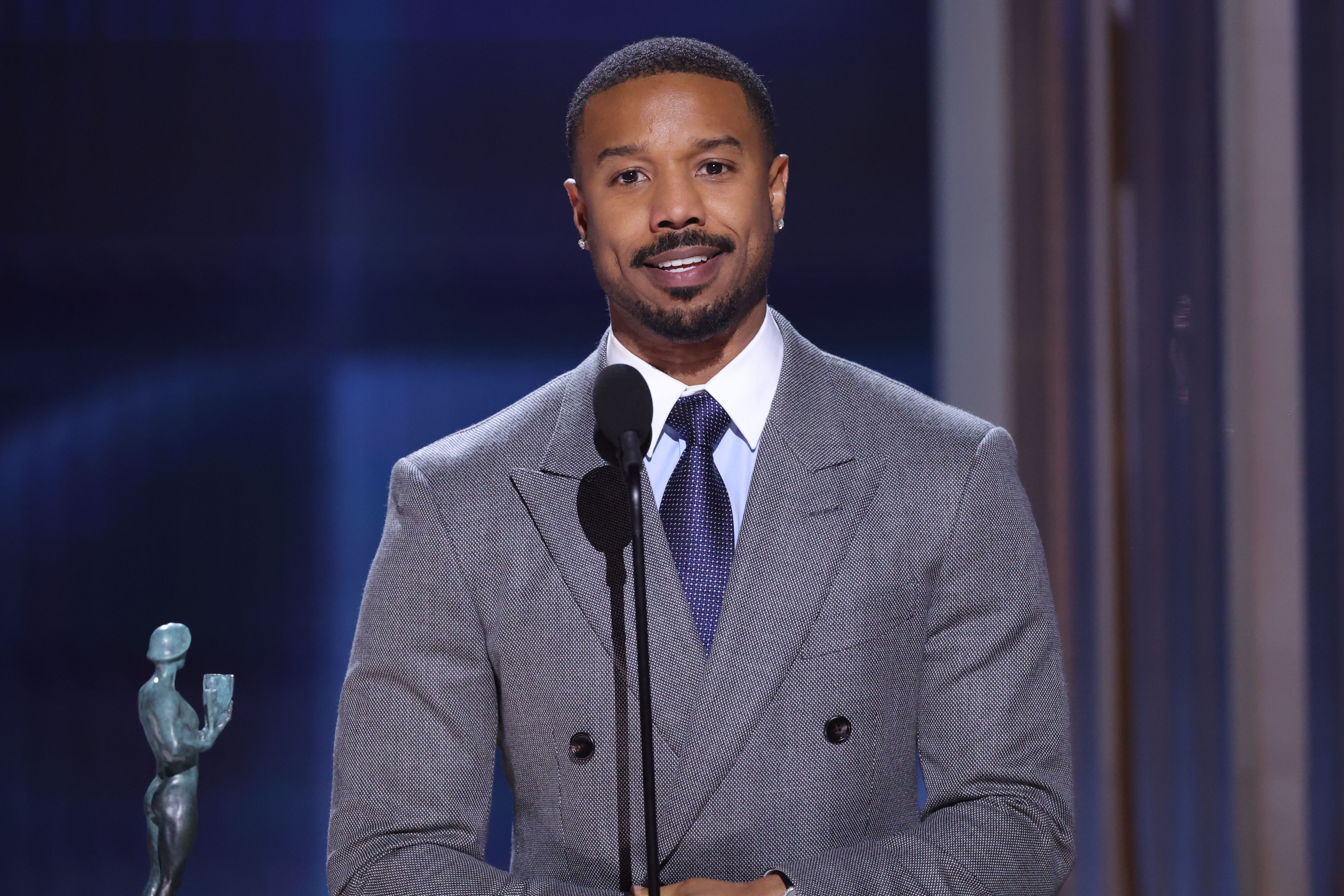 Michael B. Jordan accepts an award at the SAG Actor Awards.