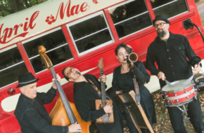South Jersey band April Mae June Bugs holding instruments in front of their tour bus