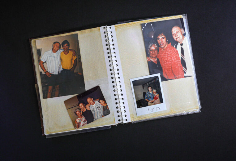 Photo of open scrapbook pages affixed with pictures of Bruce Springsteen, kept by Marion Vinyard