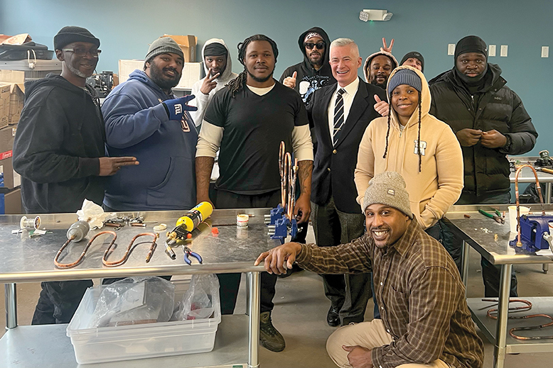 Jim McGreevey with individuals in the New Jersey Reentry Corporation
