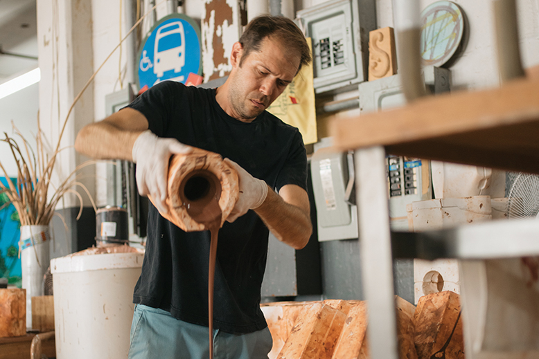 Jono Pandolfi, whose tableware appears on Hulu's "The Bear," works on a piece at his studio in Union City, NJ