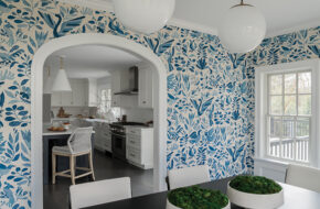 A classically arched doorway creates a seamless flow that bridges the kitchen and sunroom-turned-dining space in this Madison, NJ, home.