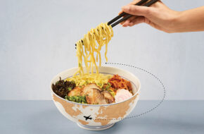 Bowl of ramen with illustration of plane flying around it