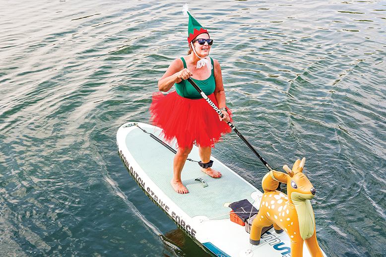 Woman participating in Spring Lake Santa Paddle in Spring Lake, NJ