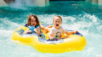 Two children on serpentine tube slide at Thundering Surf Waterpark in Beach Haven in LBI, NJ