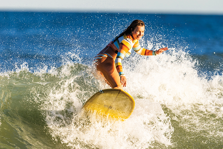 Caroline Duerr surfing at Manasquan Beach, NJ