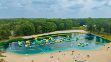 Aerial shot of the Splash Zone, a massive inflatable obstacle course at Darlington Lake in Mahwah, NJ