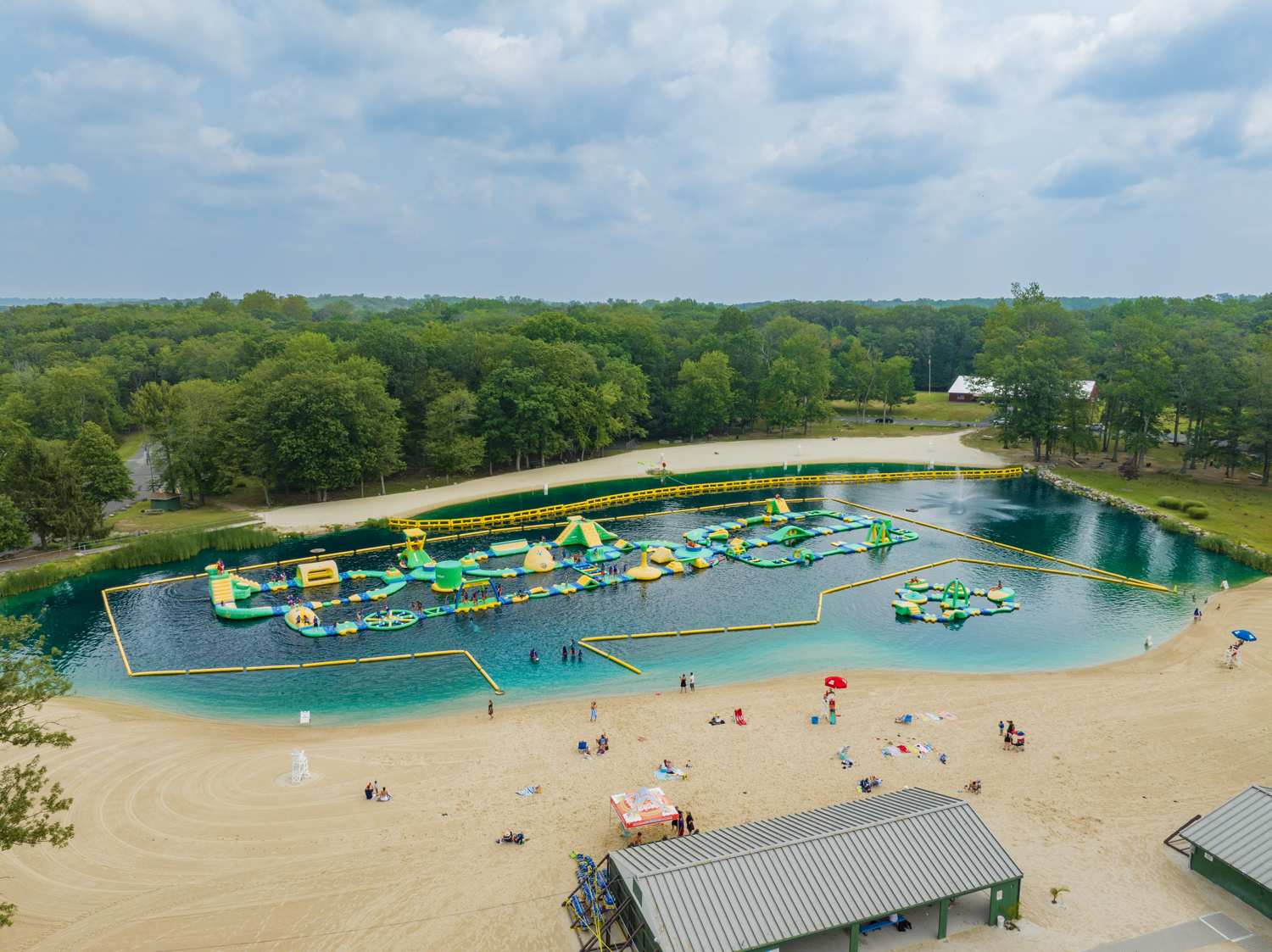 Aerial shot of the Splash Zone, a massive inflatable obstacle course at Darlington Lake in Mahwah, NJ