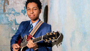 Marel Hidalgo with a guitar