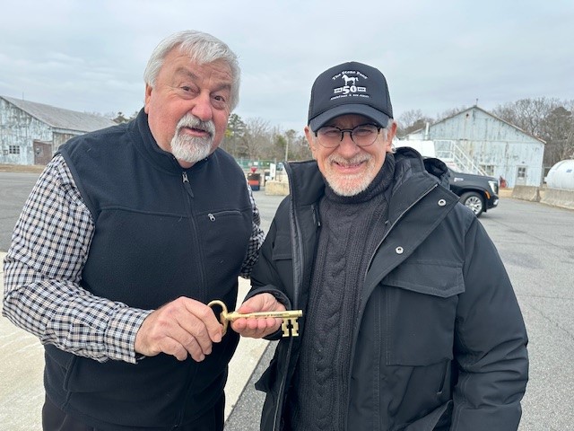 Woodbine Mayor William Pikolycky presents Spielberg with a key to the town.