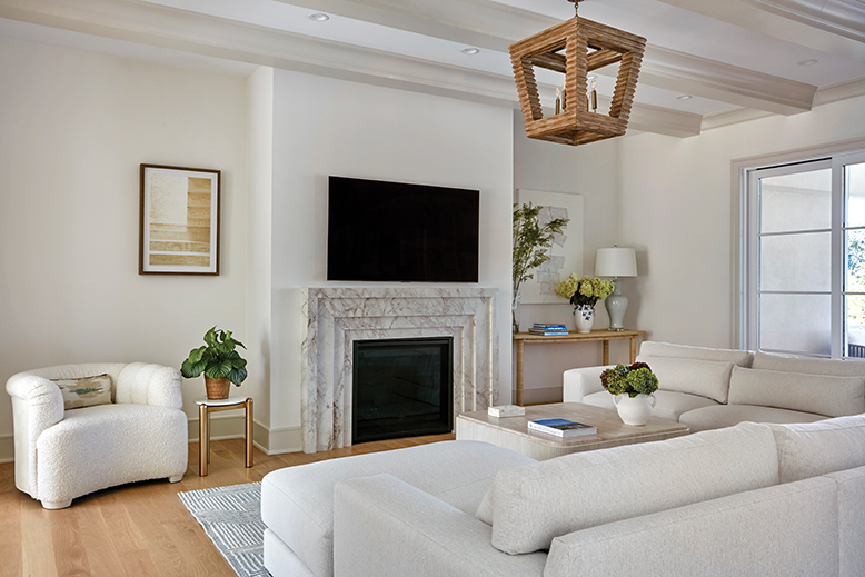Family room with fireplace in home in Oakhurst, NJ