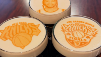 Glasses of Guinness with Knicks logos and player Jalen Brunson printed on foam at Cloverleaf Tavern in Caldwell, NJ