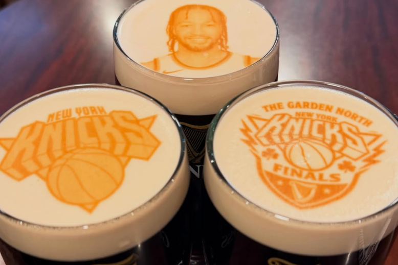 Glasses of Guinness with Knicks logos and player Jalen Brunson printed on foam at Cloverleaf Tavern in Caldwell, NJ