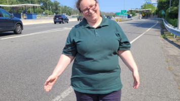 Former toll collector Allison E. Allen stands near Exit 5, where her toll booth once stood before all toll booths were removed.