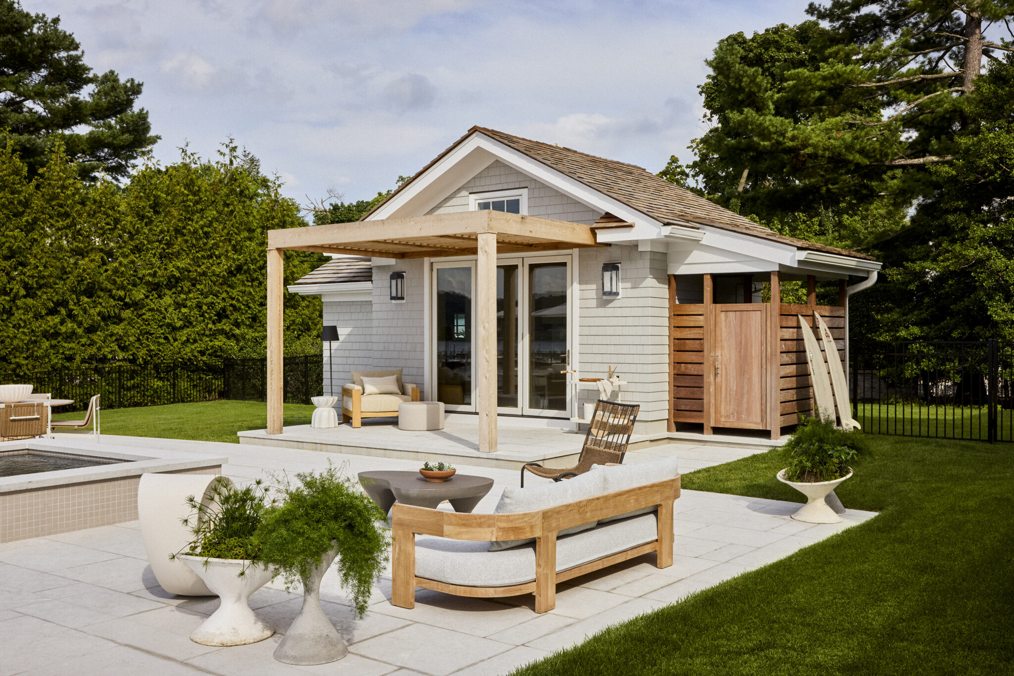 Seating outside pool house in backyard of home in Fair Haven, NJ