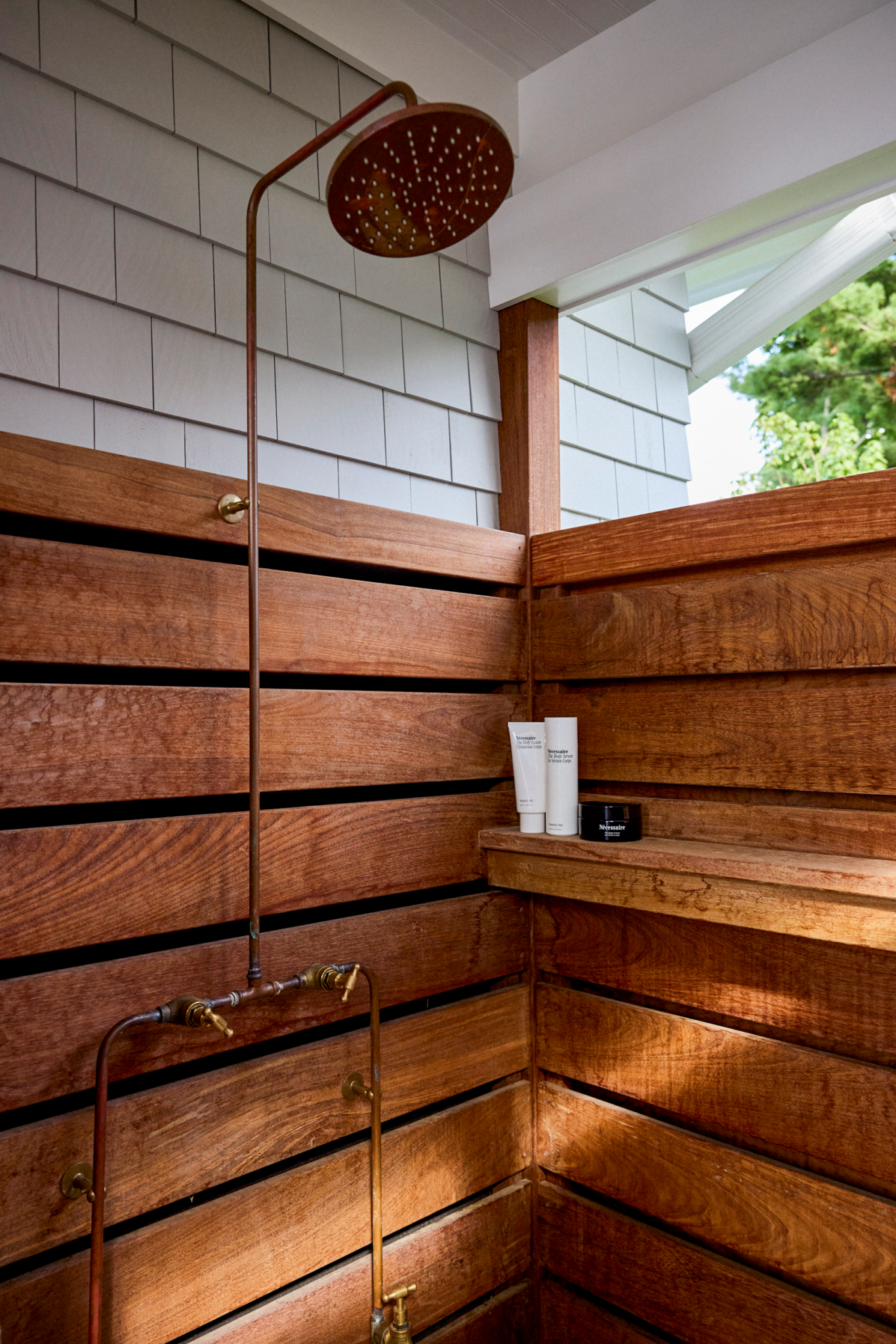 Outdoor shower in pool house in backyard of home in Fair Haven, NJ