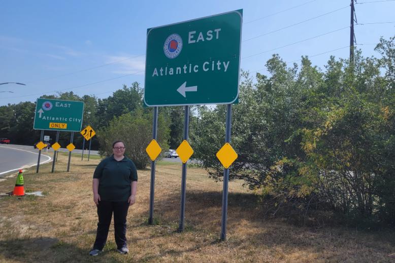 Former toll collector Allison E. Allen, wearing her green Atlantic City Expressway uniform shirt, poses in July.