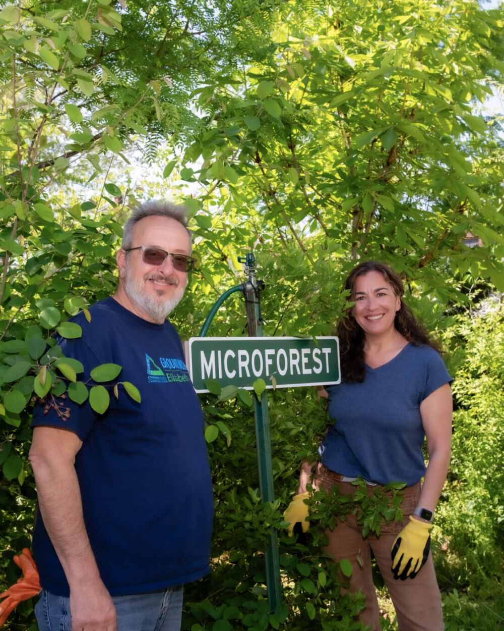 Groundwork Elizabeth’s John Evangelista and Kean professor Daniela Shebitz tend to the tiny forest in Elizabeth
