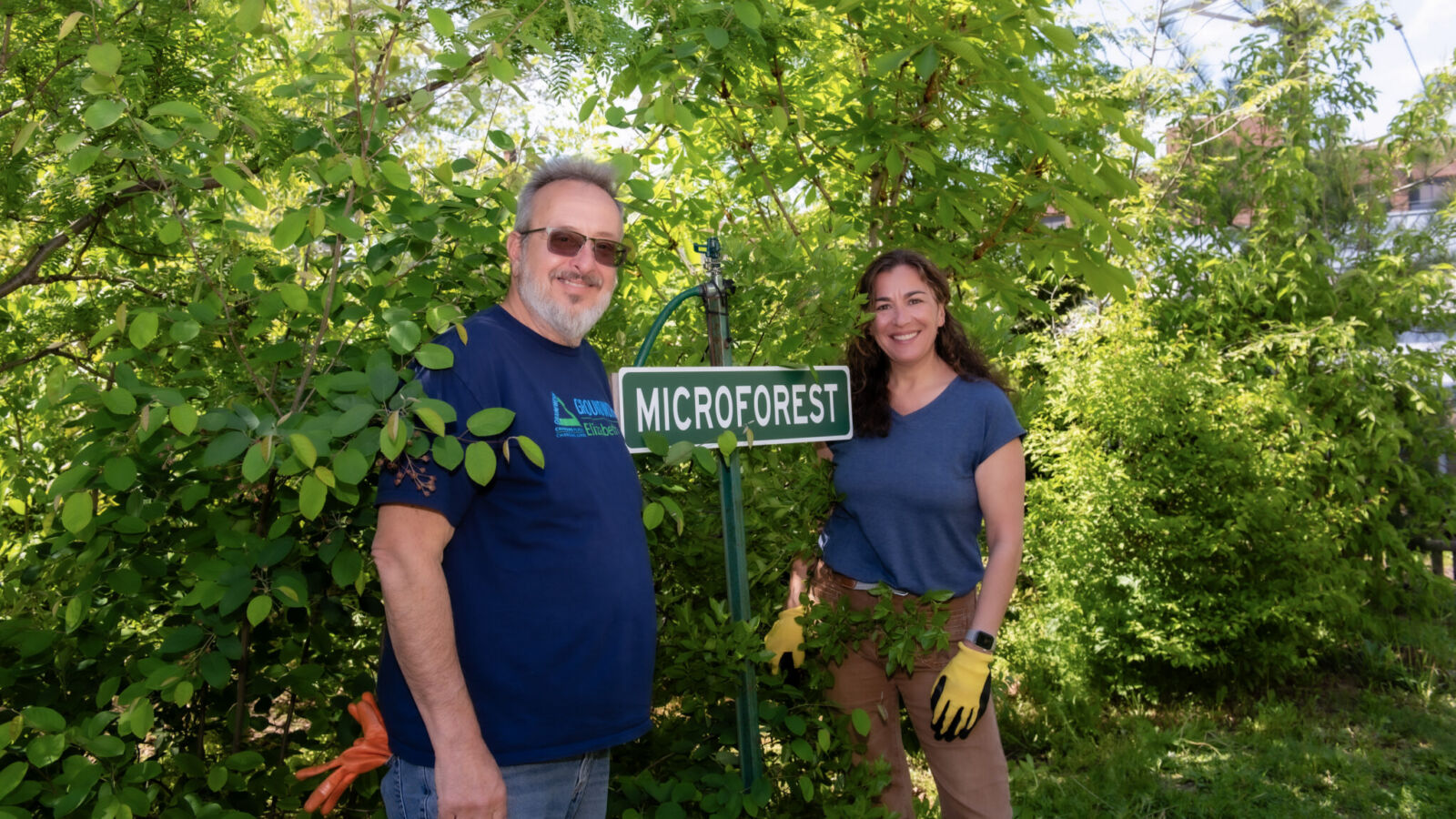Groundwork Elizabeth’s John Evangelista and Kean professor Daniela Shebitz tend to the tiny forest in Elizabeth