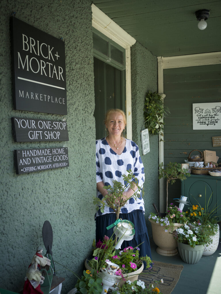 Rebecca Festa at her Brick + Mortar Marketplace in Lafayette, NJ, stocked with vendors selling an array of goods, from jewelry to soaps and candles