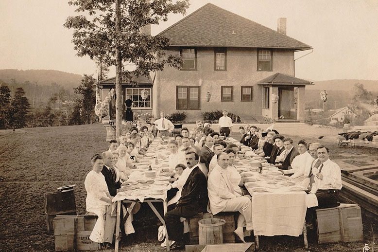 Black-and-white photo of residents attending a clambake in the early days of Mountain Lakes