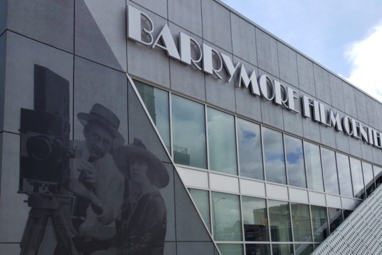 Exterior of Barrymore Film Center in Fort Lee showcasing mural of silent filmmakers
