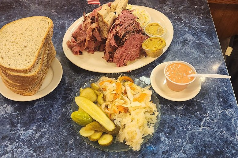 A pastrami sandwich and fixings at Harold’s New York Deli in Edison