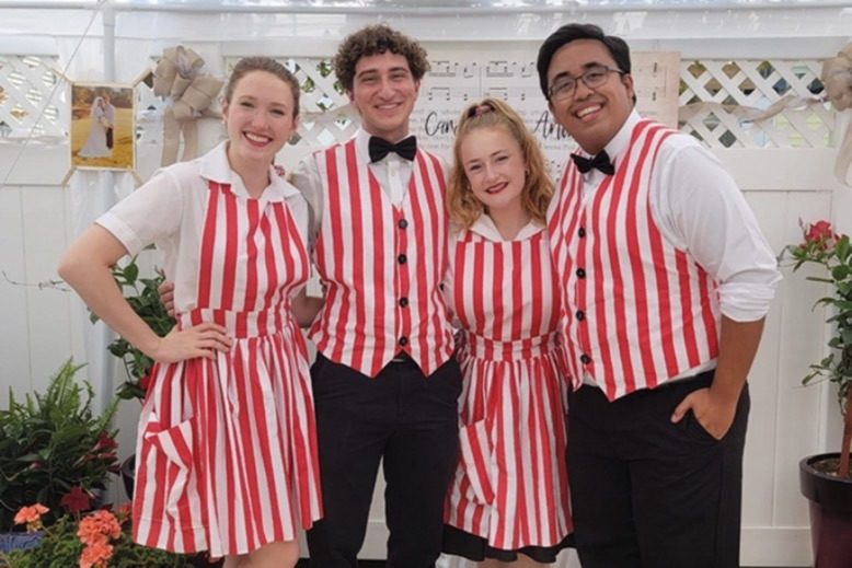 Show Place waitstaff in red and white–striped costumes.