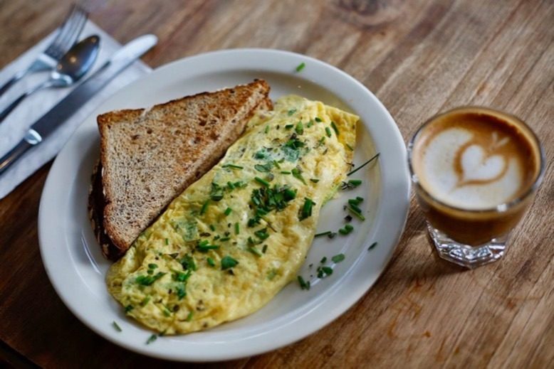 A French omelet with herbs and a side of toast and a cortado at Aunt Chubby's Luncheonette in Hopewell