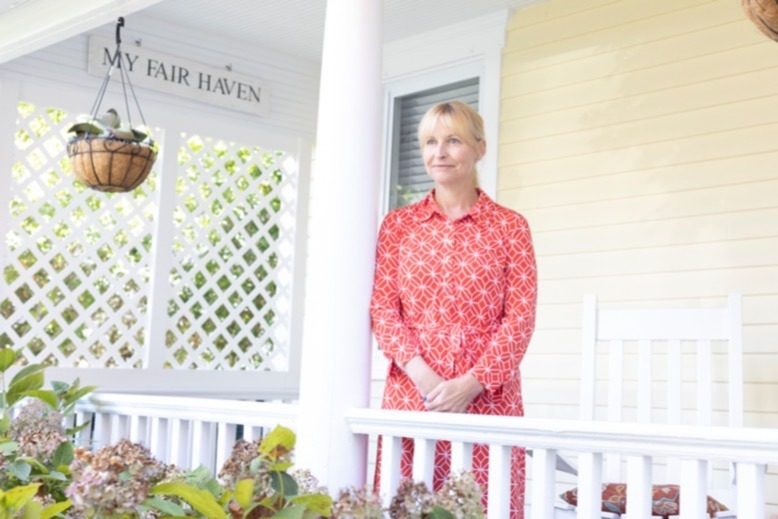 Meredith O’Brien on the porch of her Fair Haven home