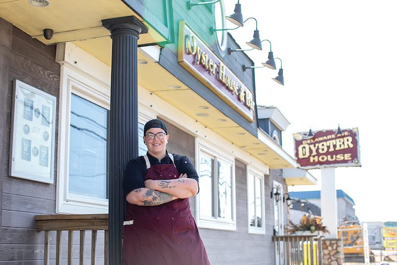 Beat Bobby Flay Champion, Chef Britt Rescigno, proudly waits outside Delaware Oyster House.