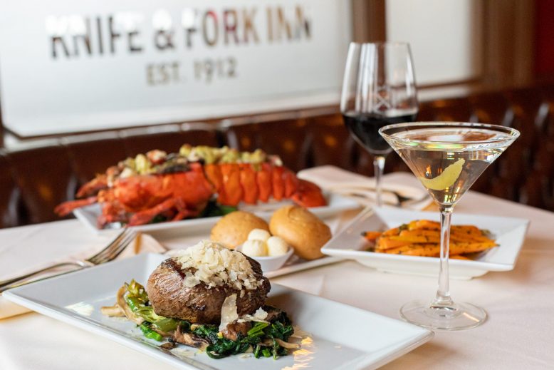 Assorted dishes and glasses of wine at Knife & Fork Inn in Atlantic City