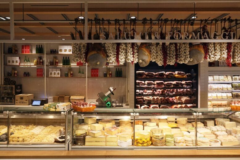 A counter at Eataly Short Hills featuring cheeses and meats