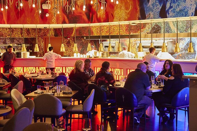 The colorfully lit dining room at Hell's Kitchen in Atlantic City
