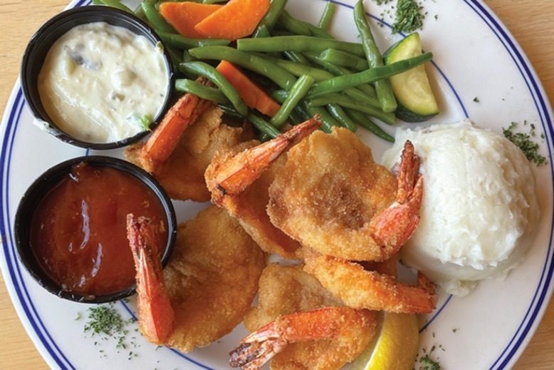 A platter of fried shrimp, mashed potatoes and vegetables at the Shrimp Box in Point Pleasant.