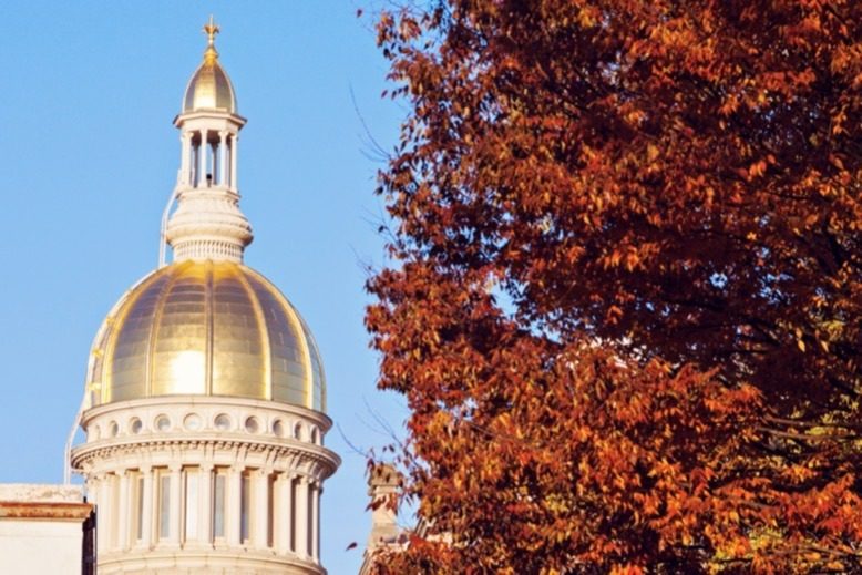 Trenton's capitol building amid fall foliage