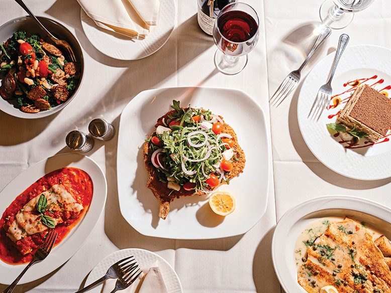 A tabletop smorgasbord of savory and sweet dishes at Amici in Cherry Hill.