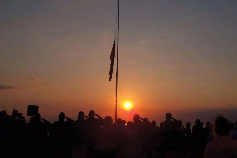 For 40 years, families, friends and beachgoers have participated in the daily Sunset Beach flag-lowering ceremony.