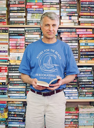 Wood Robinson, owner of Ocean City's Bookateria Two, stocks plenty of beach reading for his flip-flop wearing customers.