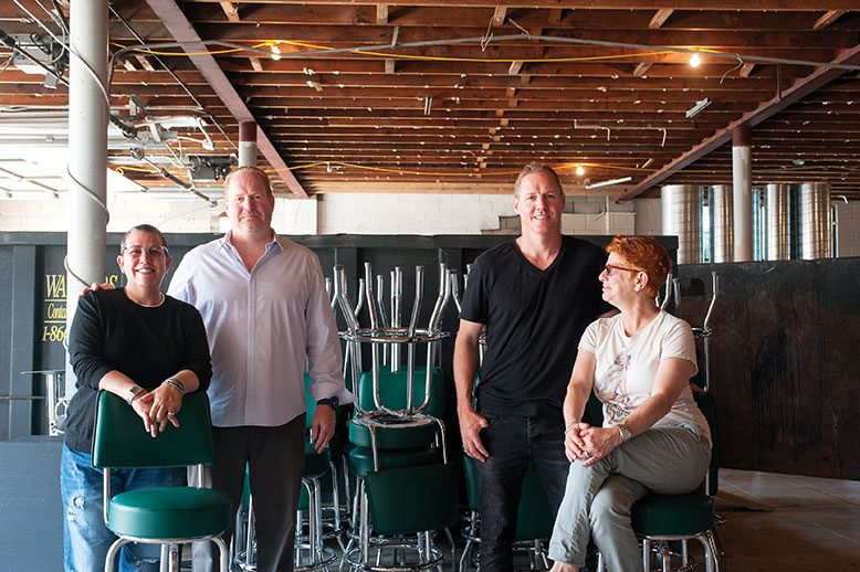 The Smith partners–from left, Meg Brunette, Jim Watt, Jason Watt and Kyle Lepree–survey the old Burlington City firehouse they aim to transform into a stylish eatery.