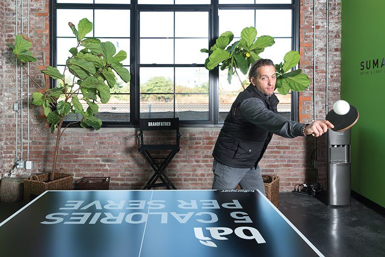 Bai5 founder Ben Weiss at the ping-pong tale outside his office at Bair Brands in Hamilton. Staff brainstorming often takes place around ping-pong.