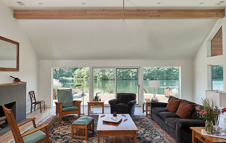 Light pours into the living room of Kathy and John Junek's Sussex County lake house.