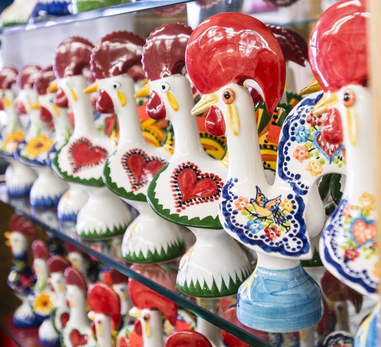 Traditional ceramic roosters beckon shoppers at Portugalia Sales in Newark.
