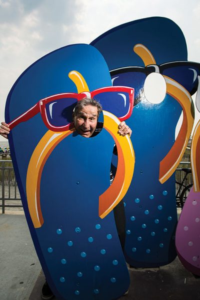 Mark Soifer, Ocean City's ultimate showman, poses at a typicially whimsical boardwalk attraction.